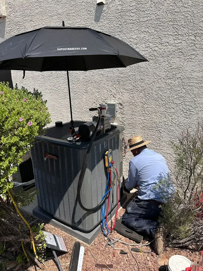 HVAC technician performing outdoor AC maintenance in Salisbury